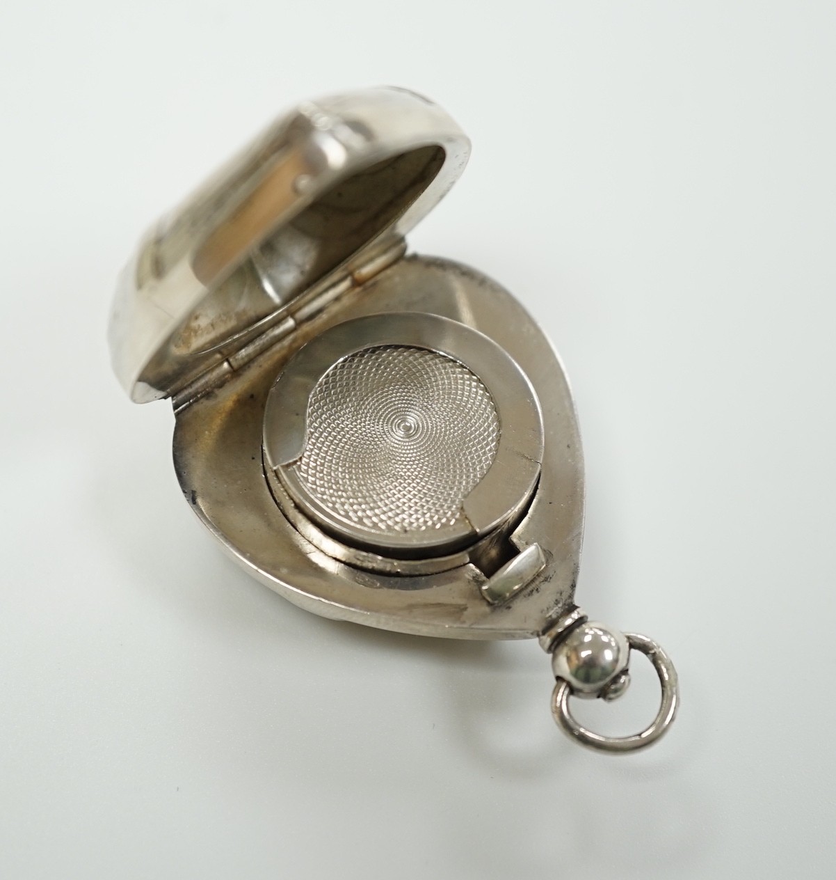 A French? white metal heart shaped gold 20 francs? case, overall 49mm.